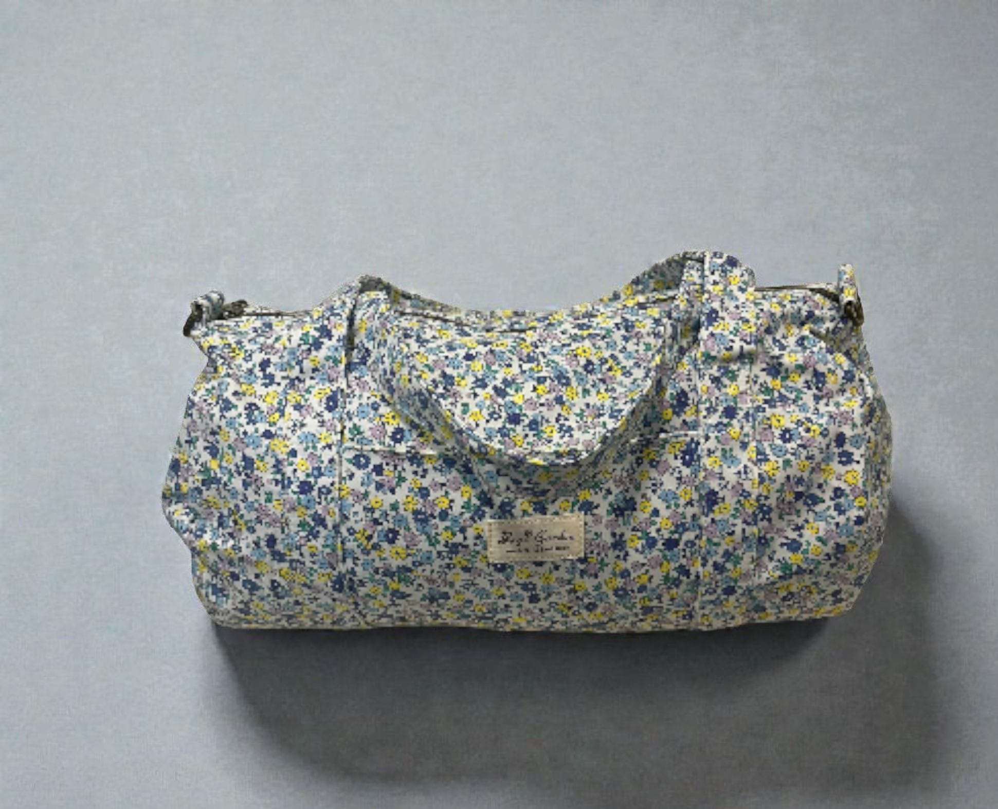 LIBERTY-  Bolsa de viaje azul con flores azules y amarillas