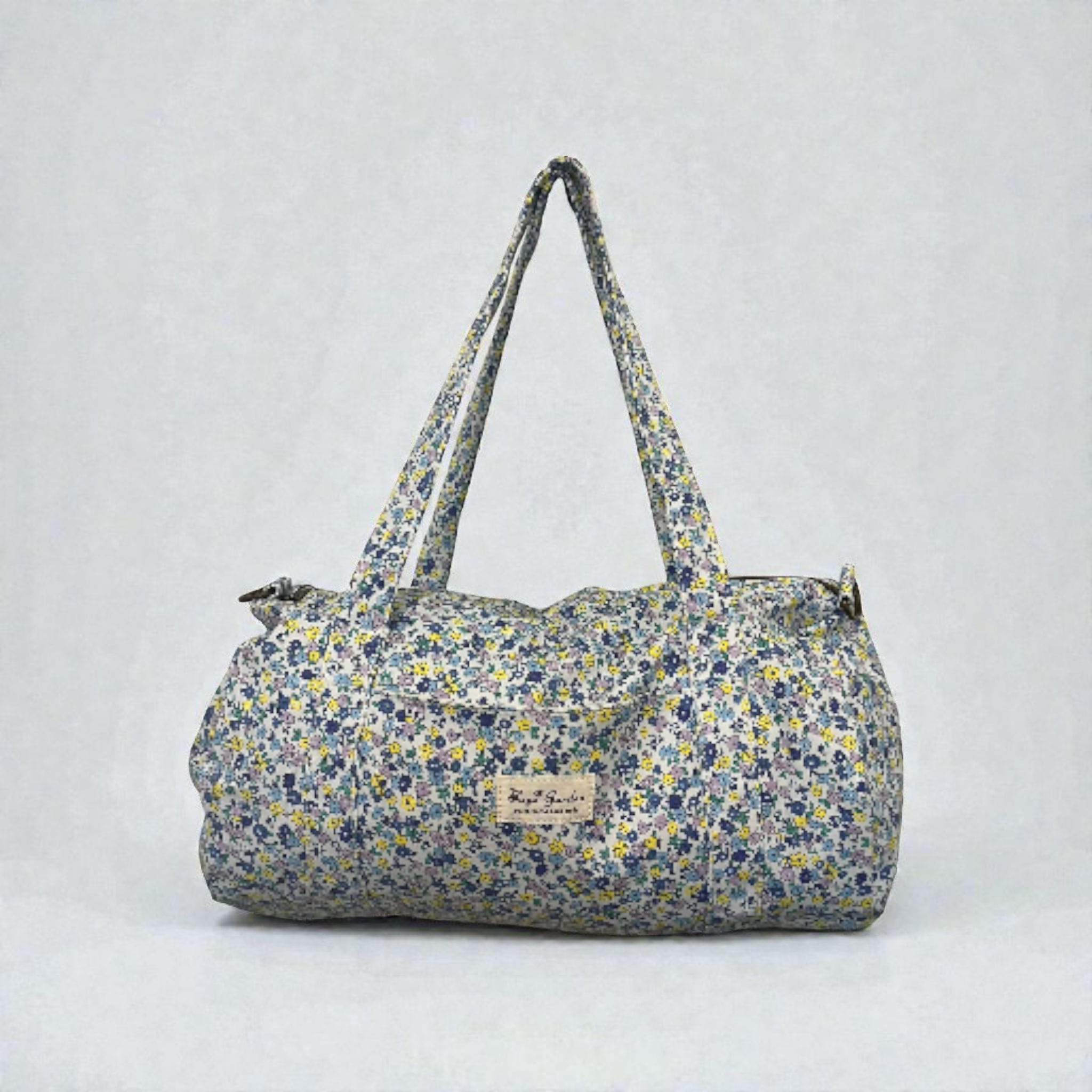 LIBERTY-  Bolsa de viaje azul con flores azules y amarillas