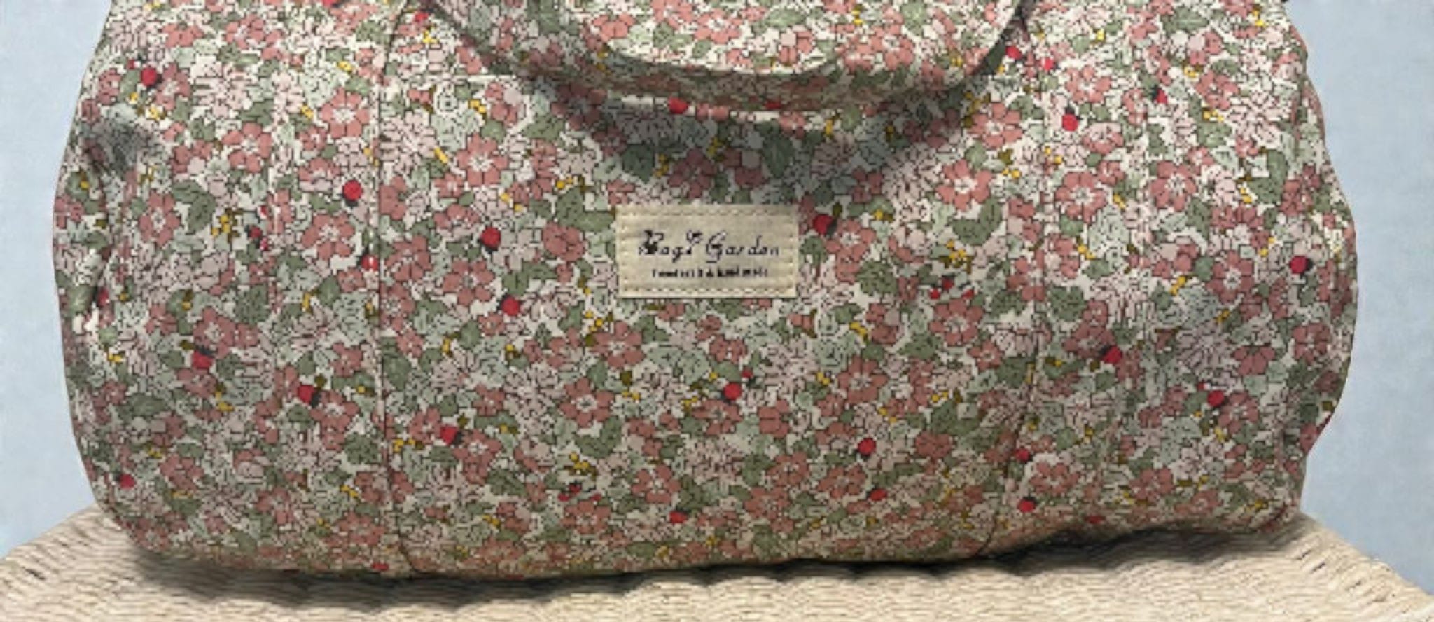 LIBERTY-  Bolsa de viaje con flores rosas y verdes